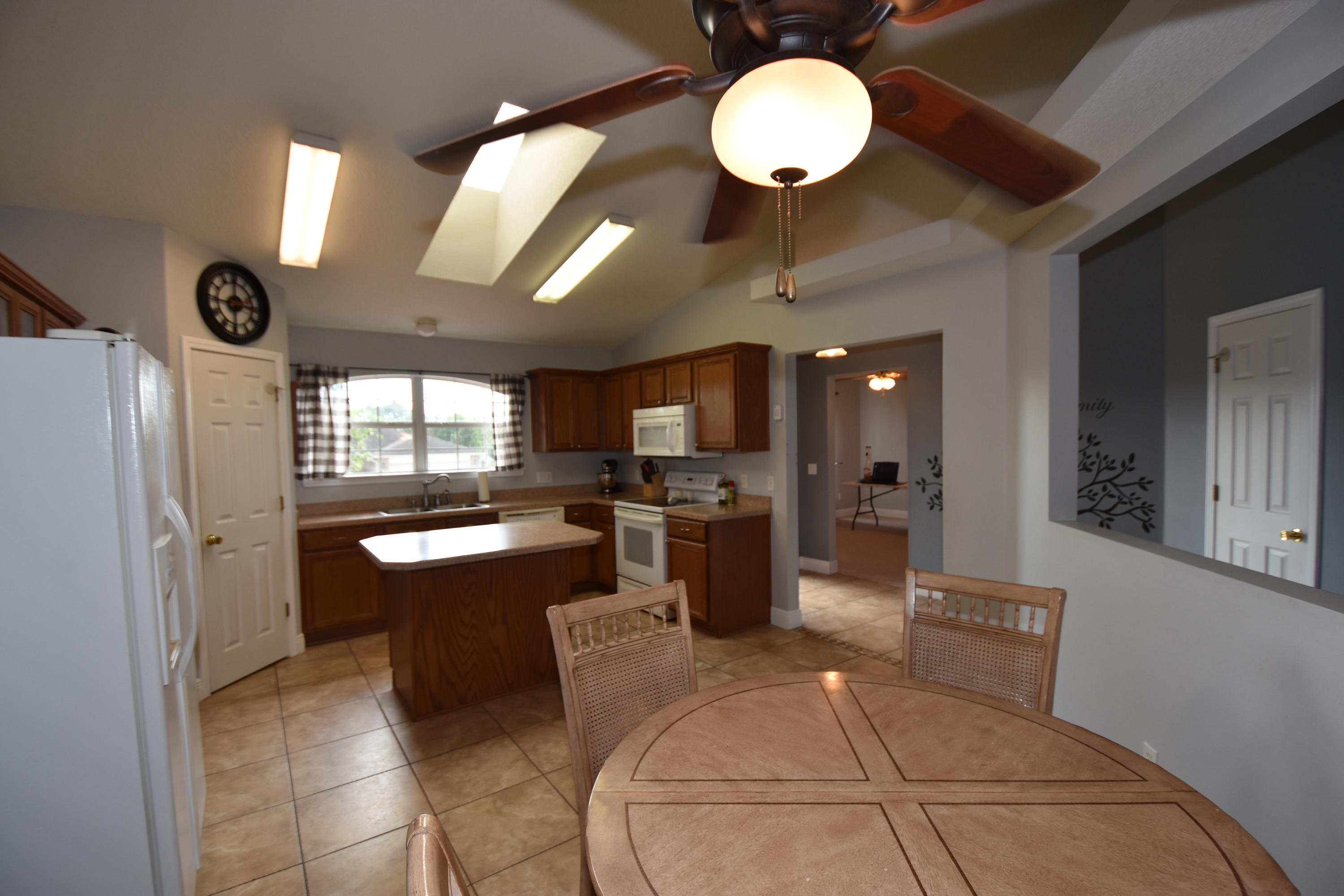 1222 Northview Drive Crestview, FL 32536 - Photo 13 of 36 a large kitchen with a counter space a sink stainless steel appliances and cabinets