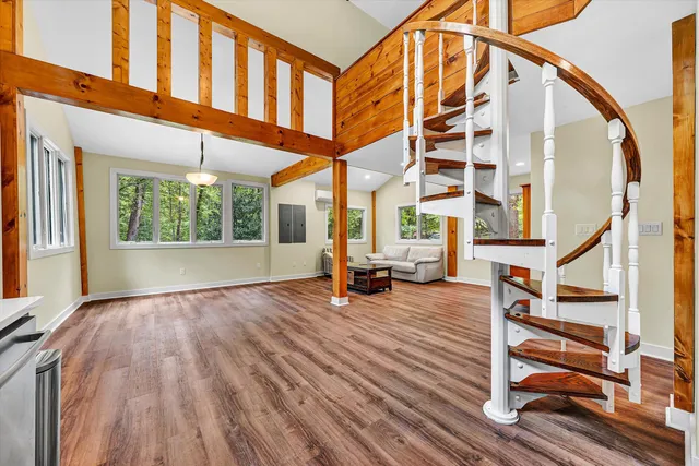 a view of an entryway with wooden floor and windows