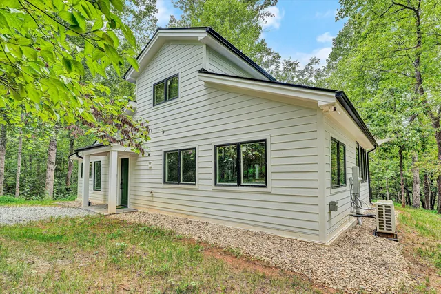 a view of a lake with houses in outdoor space