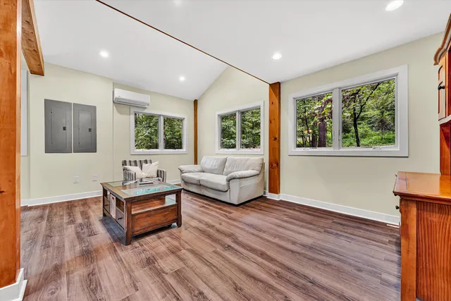 a living room with furniture and a large window