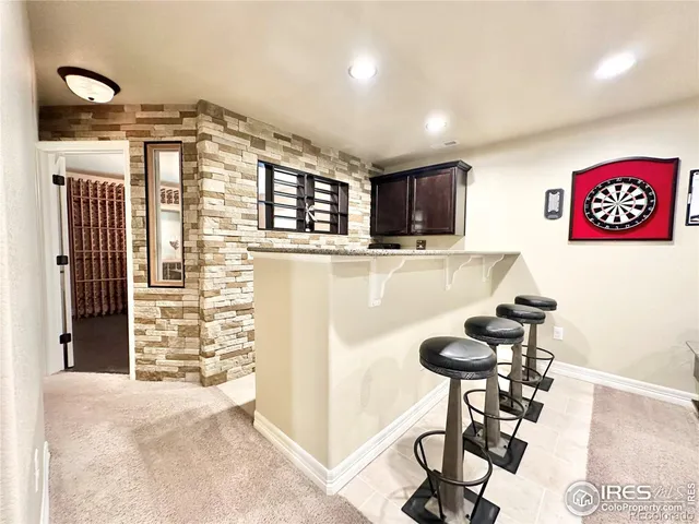 a view of a livingroom with furniture and gym equipment