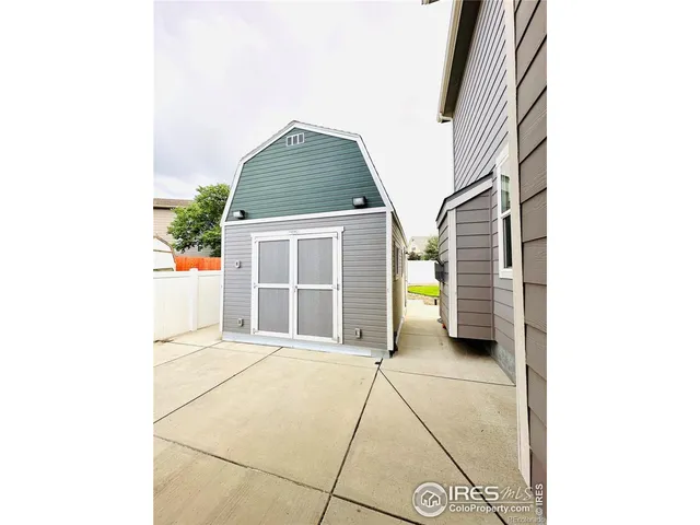 a view of a terrace with a table and chairs
