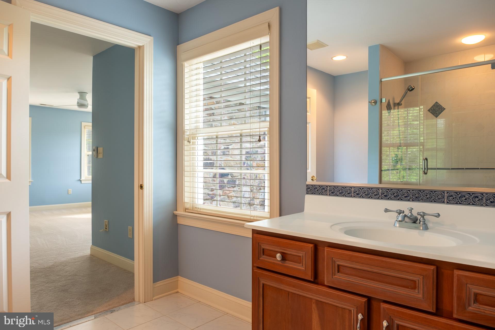 2 Garden Path, Unit 14 Doylestown, PA 18901 - Photo 25 of 36 Serene bathroom with natural light.