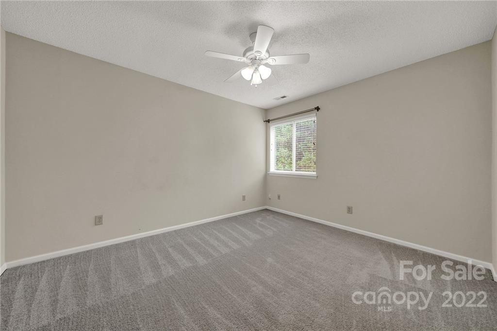 12102 Henderson Hill Road Huntersville, NC 28078 - Photo 20 of 31 an empty room with windows and fan