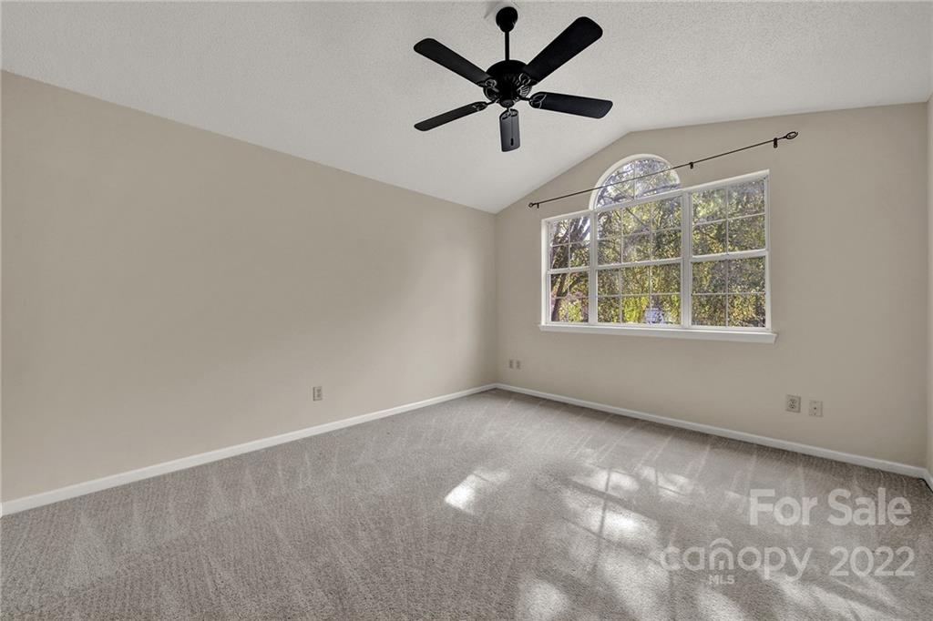 12102 Henderson Hill Road Huntersville, NC 28078 - Photo 23 of 31 an empty room with a window and a fan