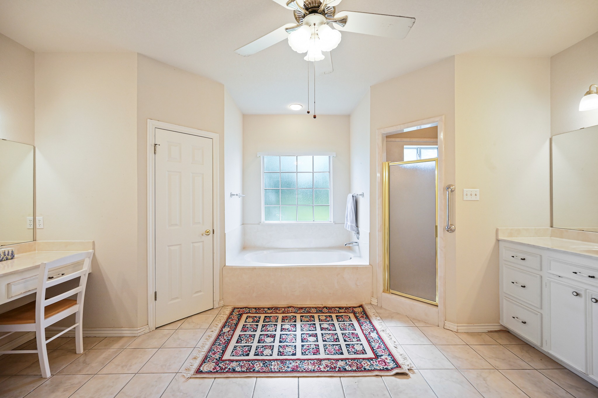 364 Nameless Road Driftwood, TX 78619 - Photo 18 of 32 Relax in the deep soaking tub or freshen up at the dual vanities in this ample primary bathroom. There are two walk in closets.