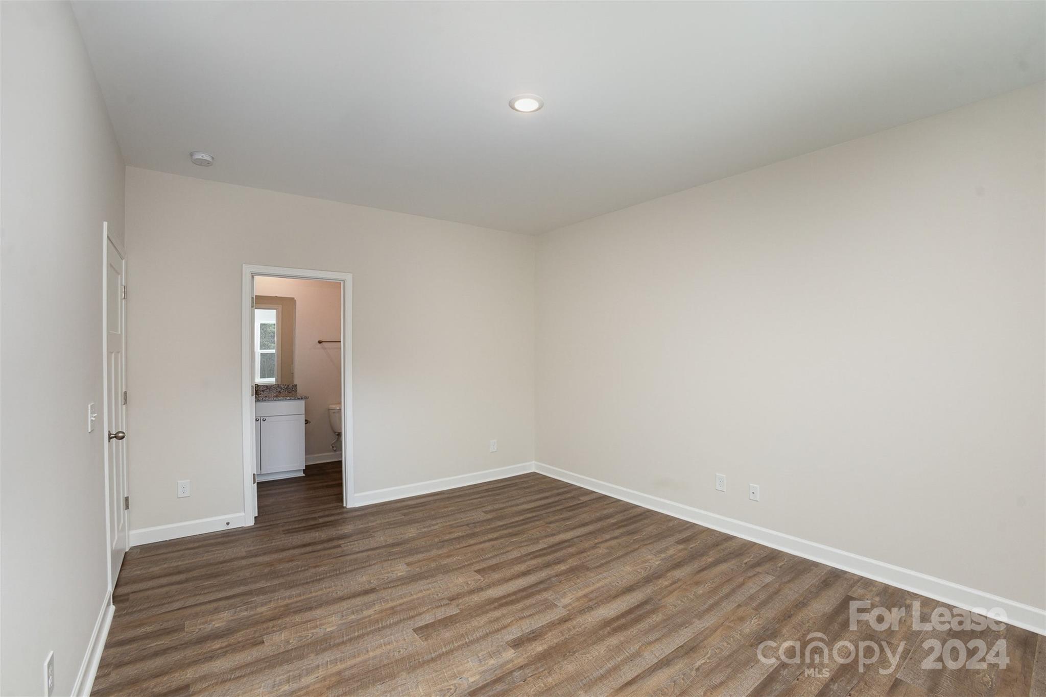 2866 Fay Jones Road Denver, NC 28037 - Photo 9 of 16 a view of an empty room with wooden floor and closet