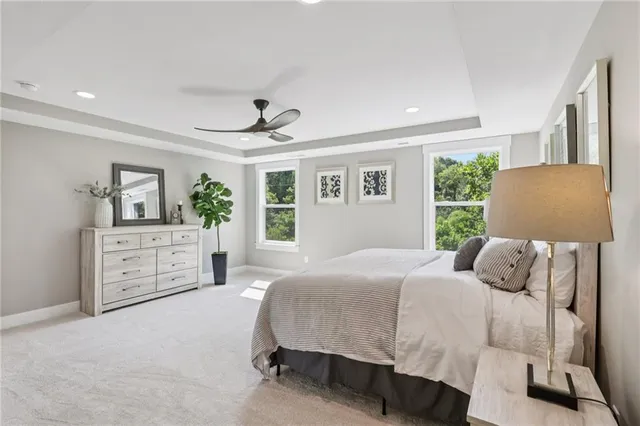 a bedroom with a large bed and a window