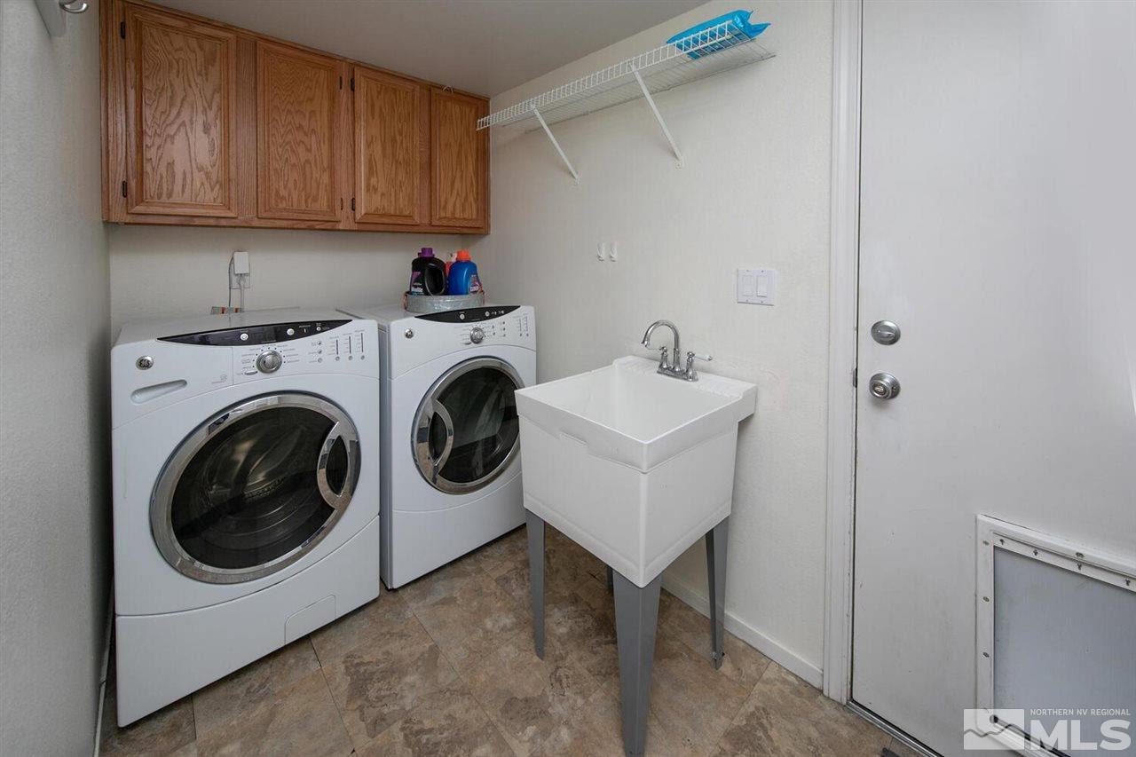 14425 Ghost Rider Drive Reno, NV 89511 - Photo 28 of 37 a utility room with sink dryer and washer