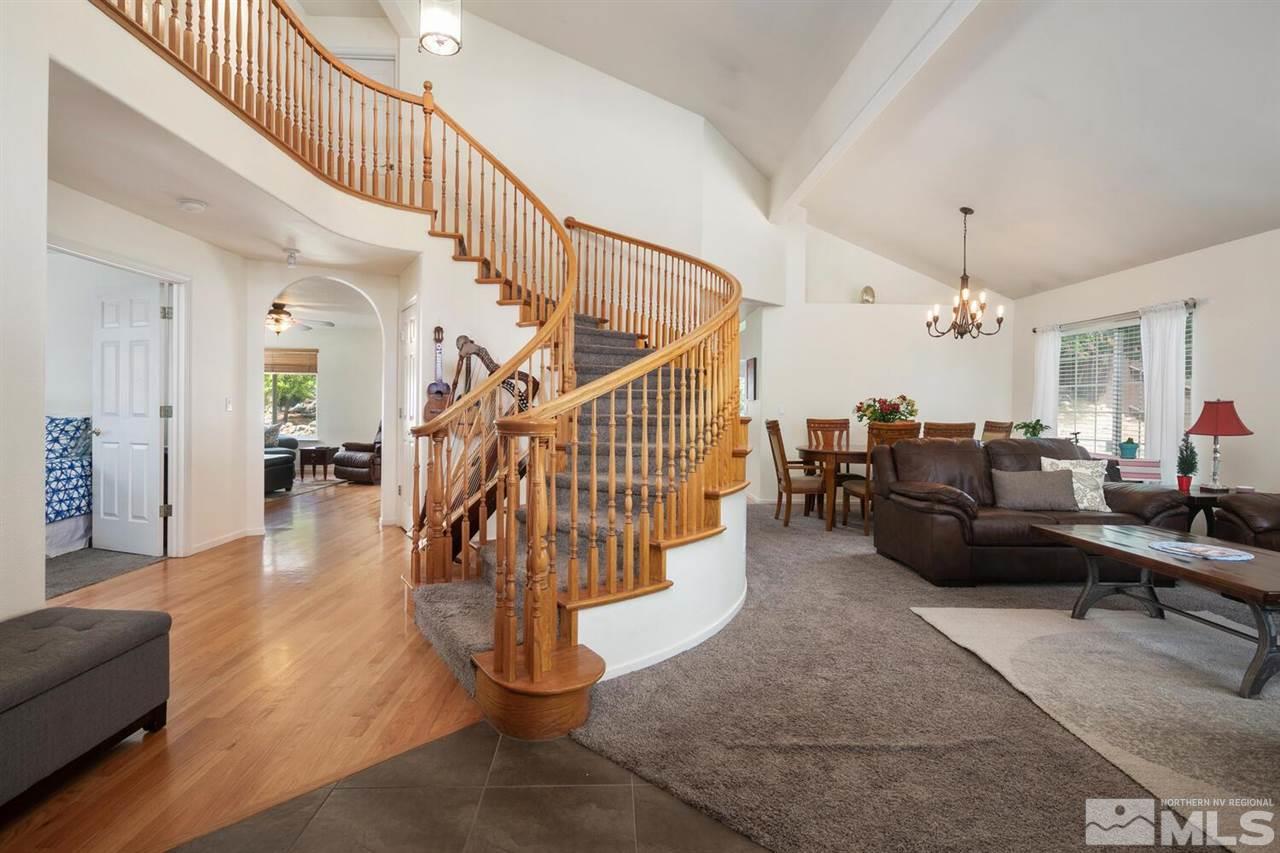 14425 Ghost Rider Drive Reno, NV 89511 - Photo 3 of 37 a living room with furniture and wooden floor