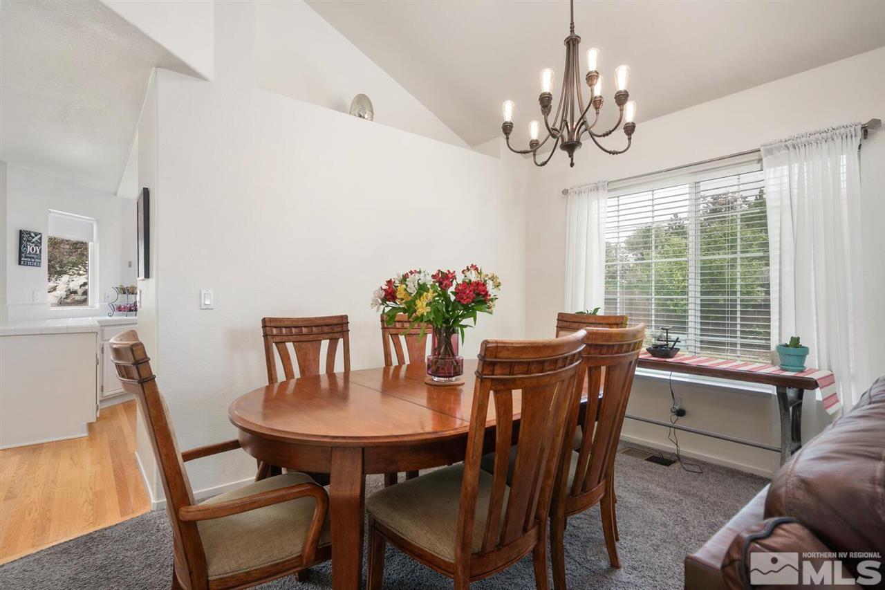 14425 Ghost Rider Drive Reno, NV 89511 - Photo 6 of 37 a view of a dining room with furniture window and outside view