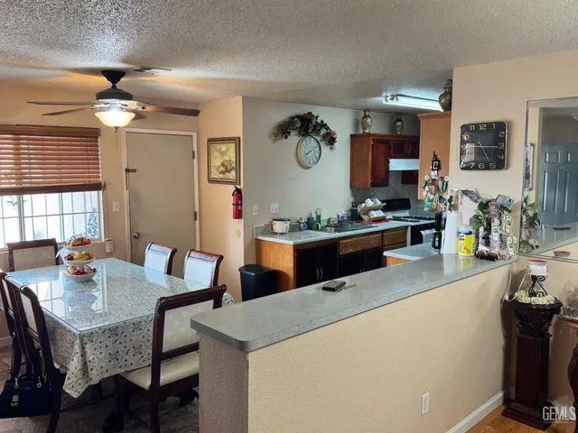 a kitchen with a dining table and chairs