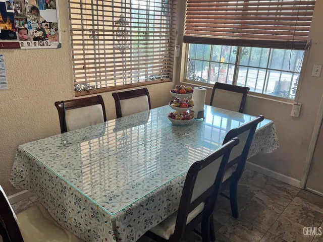 a dining room with furniture and window
