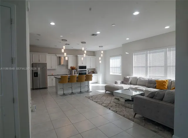 a bathroom with a granite countertop sink a shower and a mirror