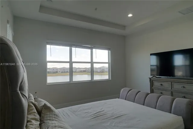 a view of a dining room with furniture and window