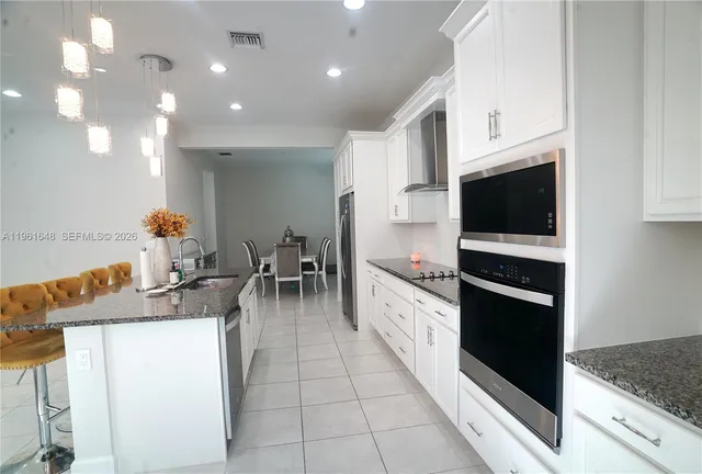 a view of backyard of house and outdoor seating