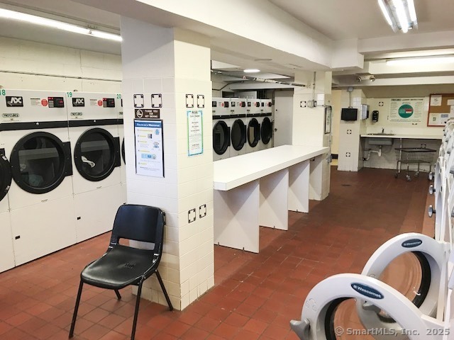 91 Strawberry Hill Avenue, Unit 925 Stamford, CT 06902 - Photo 12 of 20 a living room with stainless steel appliances furniture and kitchen view