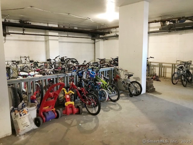 91 Strawberry Hill Avenue, Unit 925 Stamford, CT 06902 - Photo 14 of 20 a view of a garage with a bike and car