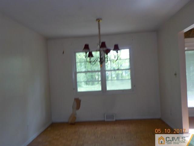 15 Nottingham Road Edison, NJ 08820 - Photo 3 of 11 wooden floor and window in an empty room