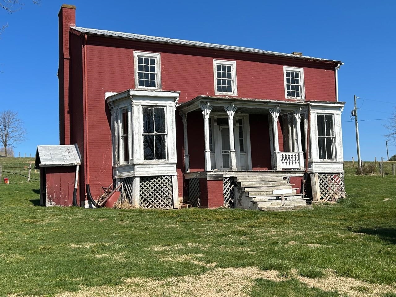 5787 Borden Grant Trail Raphine, VA 24472 - Photo 3 of 41 a front view of a house with a yard
