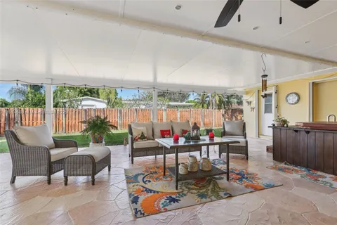 a view of a patio with a table and chairs