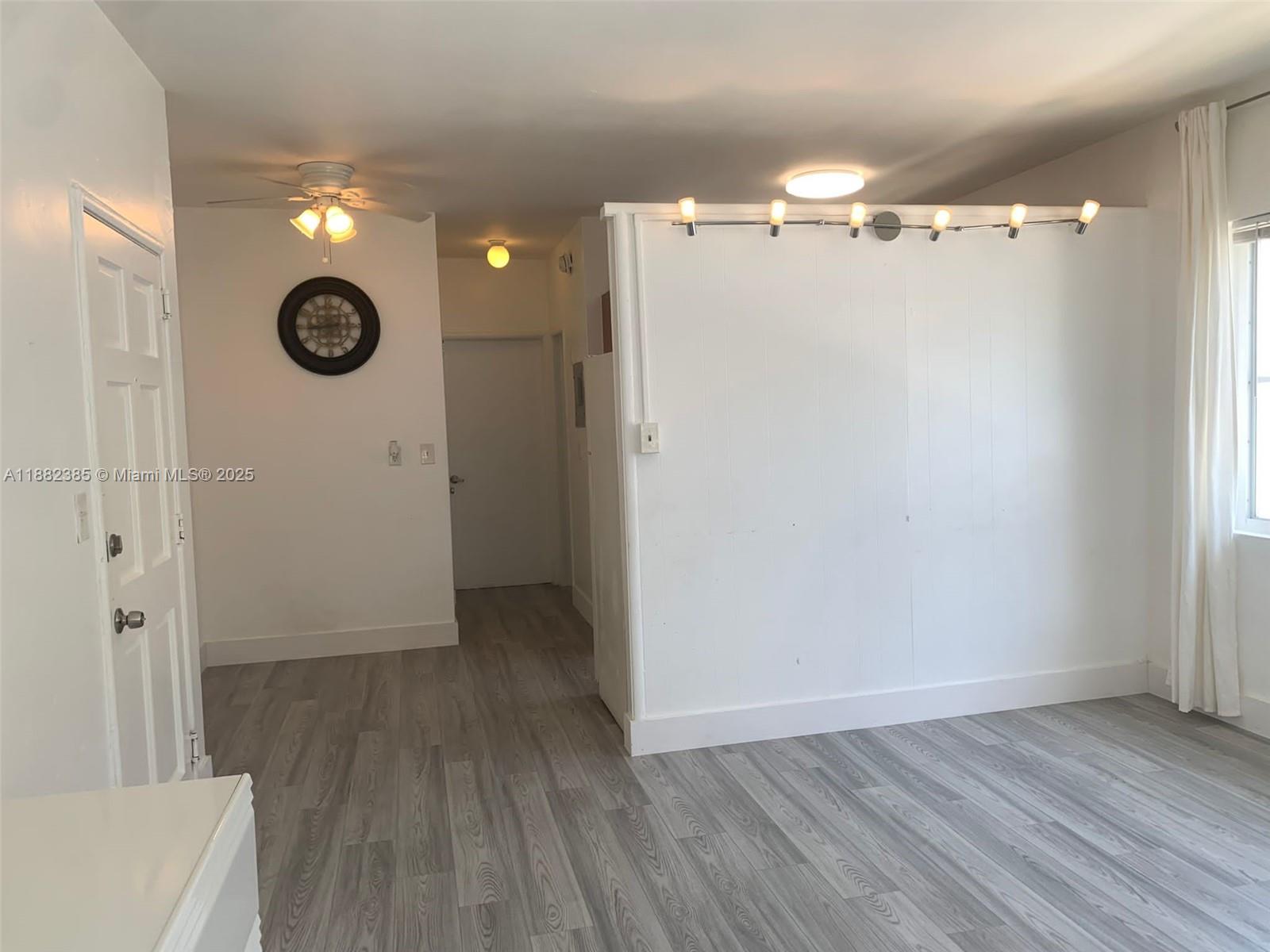 8011 Abbott Avenue, Unit 8 Miami Beach, FL 33141 - Photo 2 of 4 a view of empty room with wooden floor