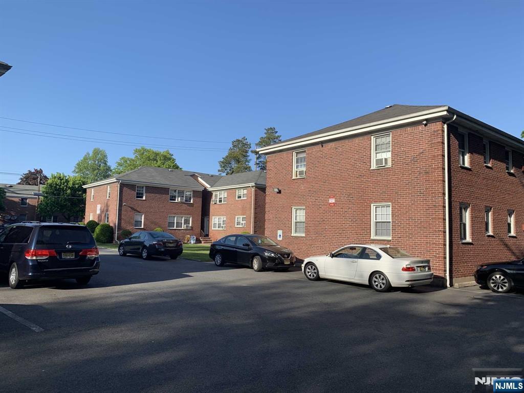 171-183 Fort Lee Road, Unit 1731C Teaneck, NJ 07666 - Photo 3 of 15 a couple of cars parked in front of a house