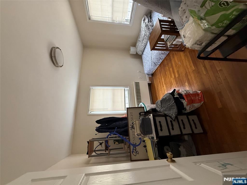 171-183 Fort Lee Road, Unit 1731C Teaneck, NJ 07666 - Photo 10 of 15 a bedroom with furniture and a window