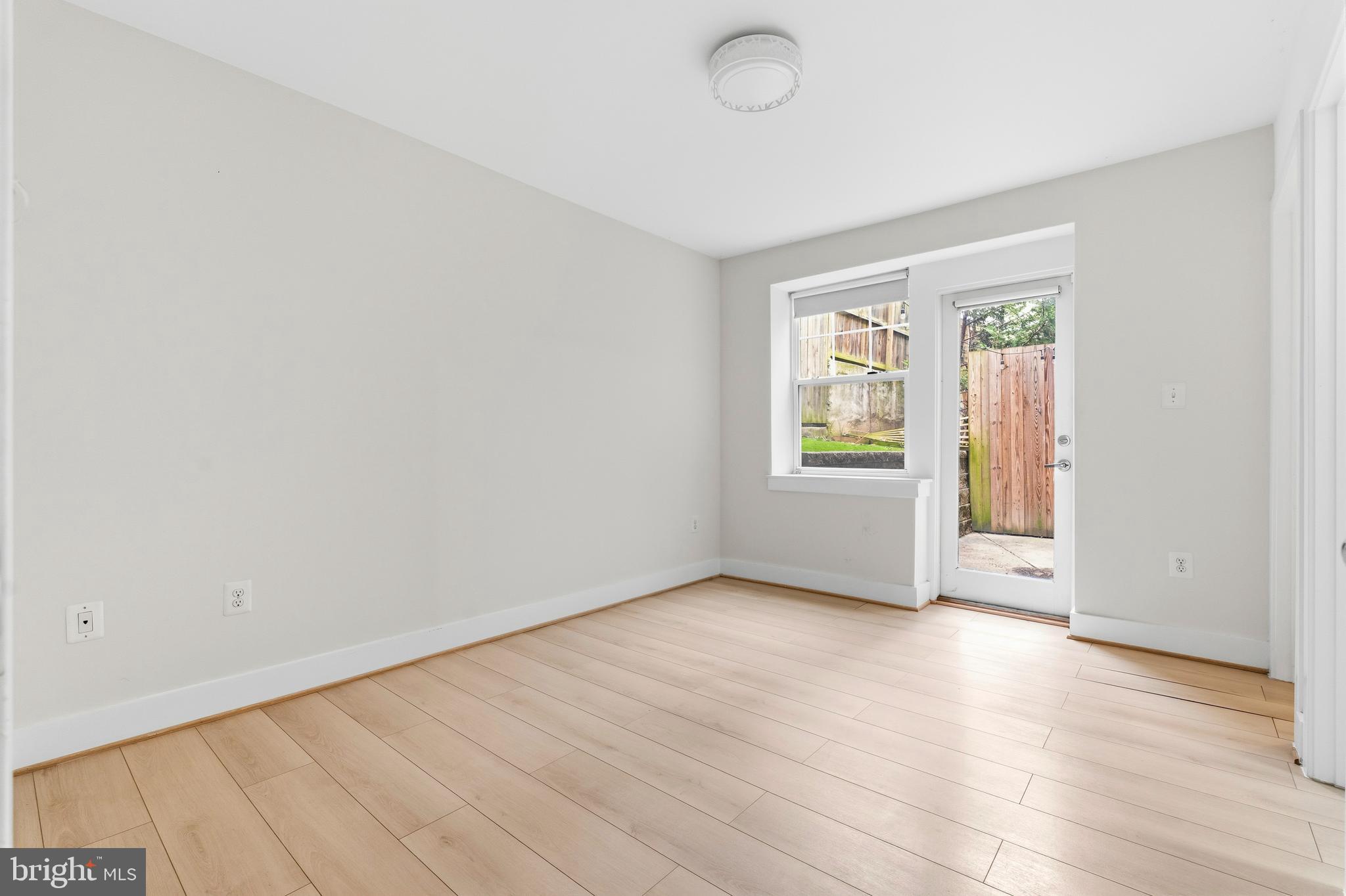 4226 7th Street Northwest, Unit 101 Washington, DC 20011 - Photo 16 of 23 an empty room with window