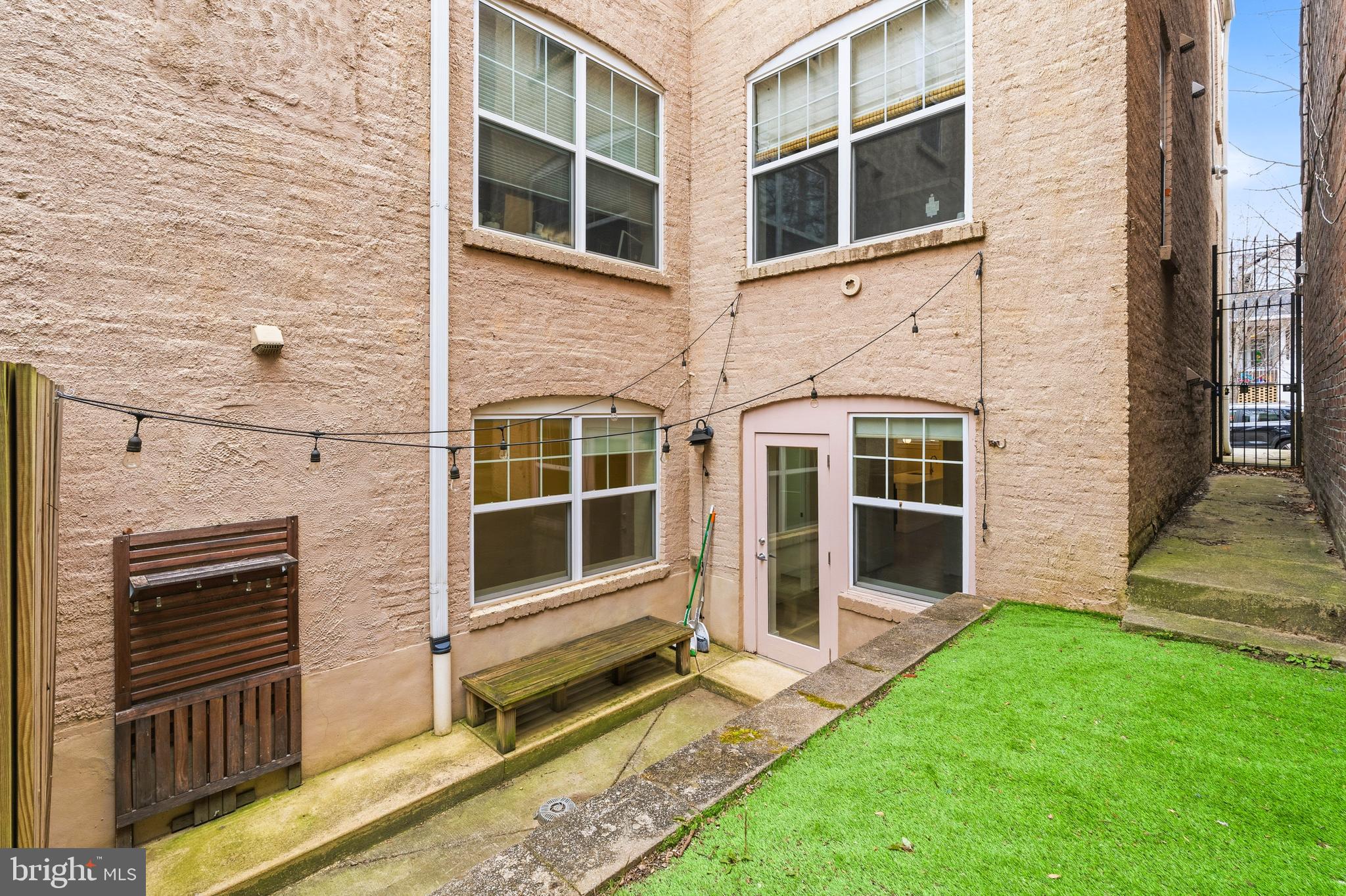 4226 7th Street Northwest, Unit 101 Washington, DC 20011 - Photo 21 of 23 a view of front door of house with a yard