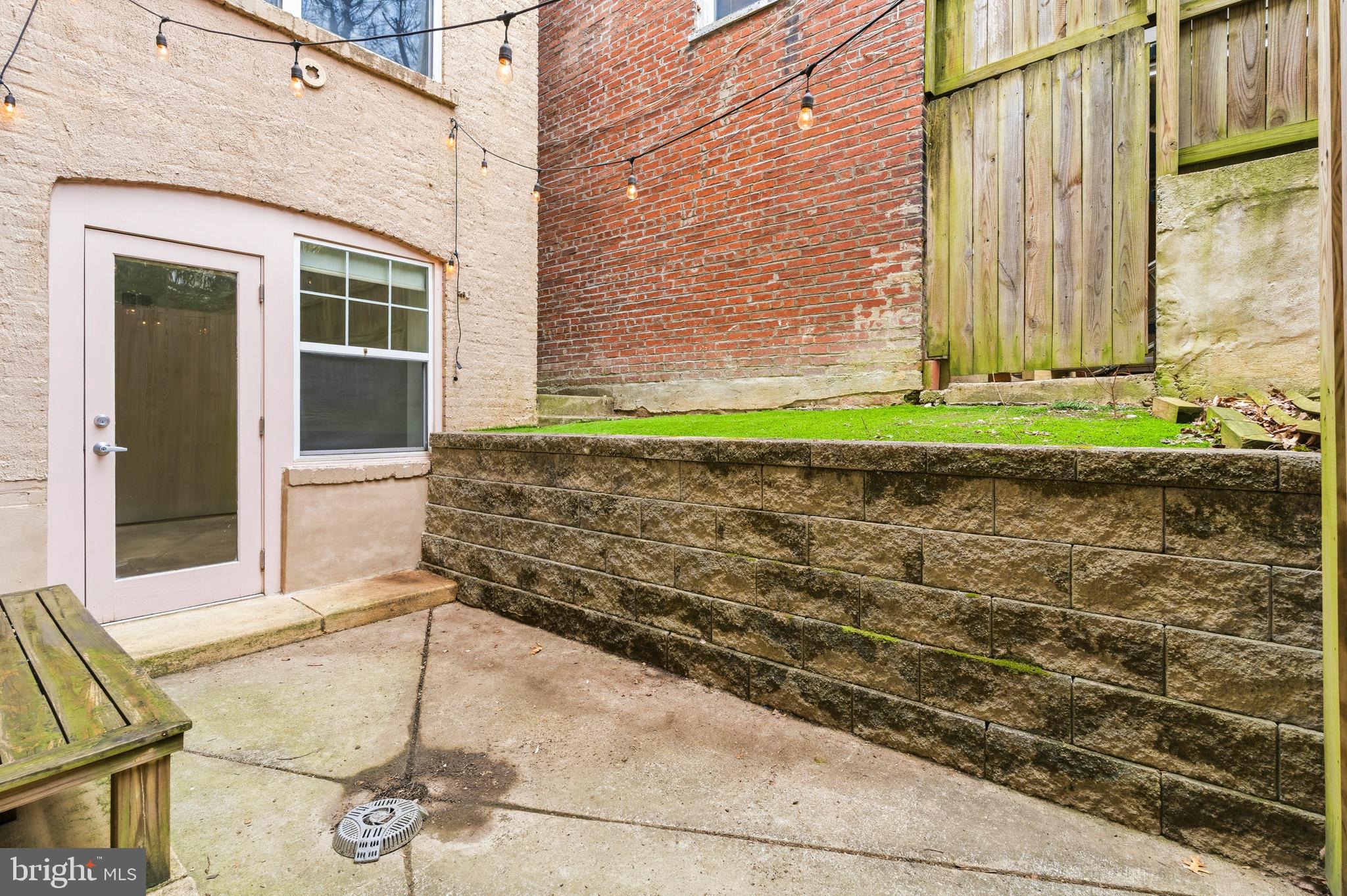 4226 7th Street Northwest, Unit 101 Washington, DC 20011 - Photo 22 of 23 a front view of a house with a yard and garage