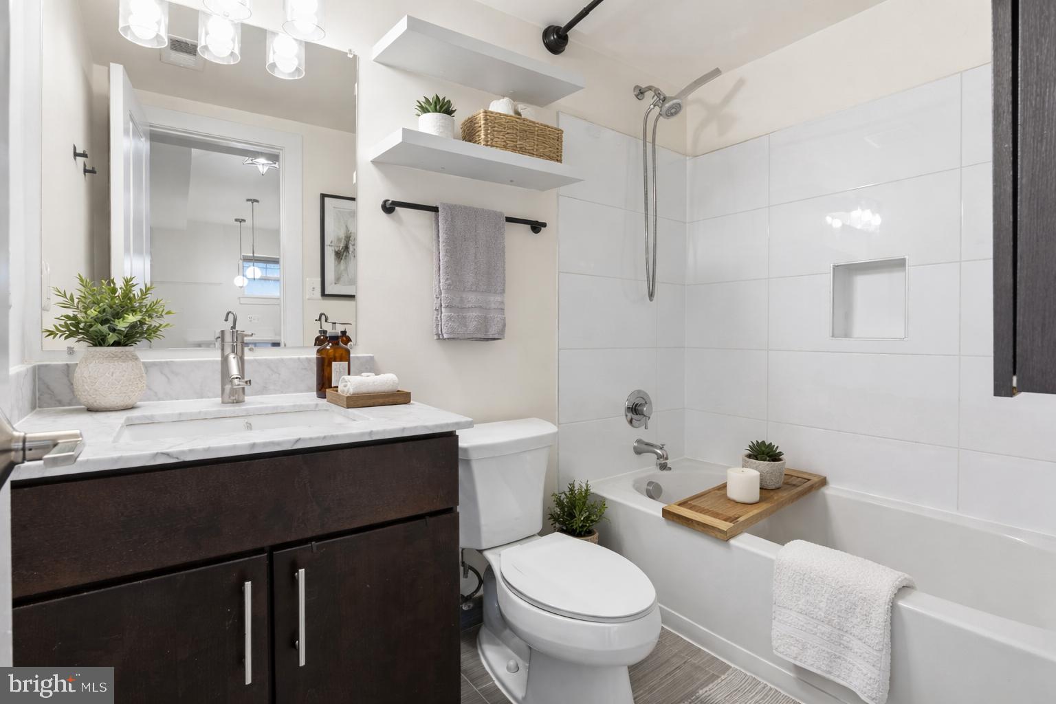 4226 7th Street Northwest, Unit 101 Washington, DC 20011 - Photo 9 of 23 a bathroom with a sink toilet and shower