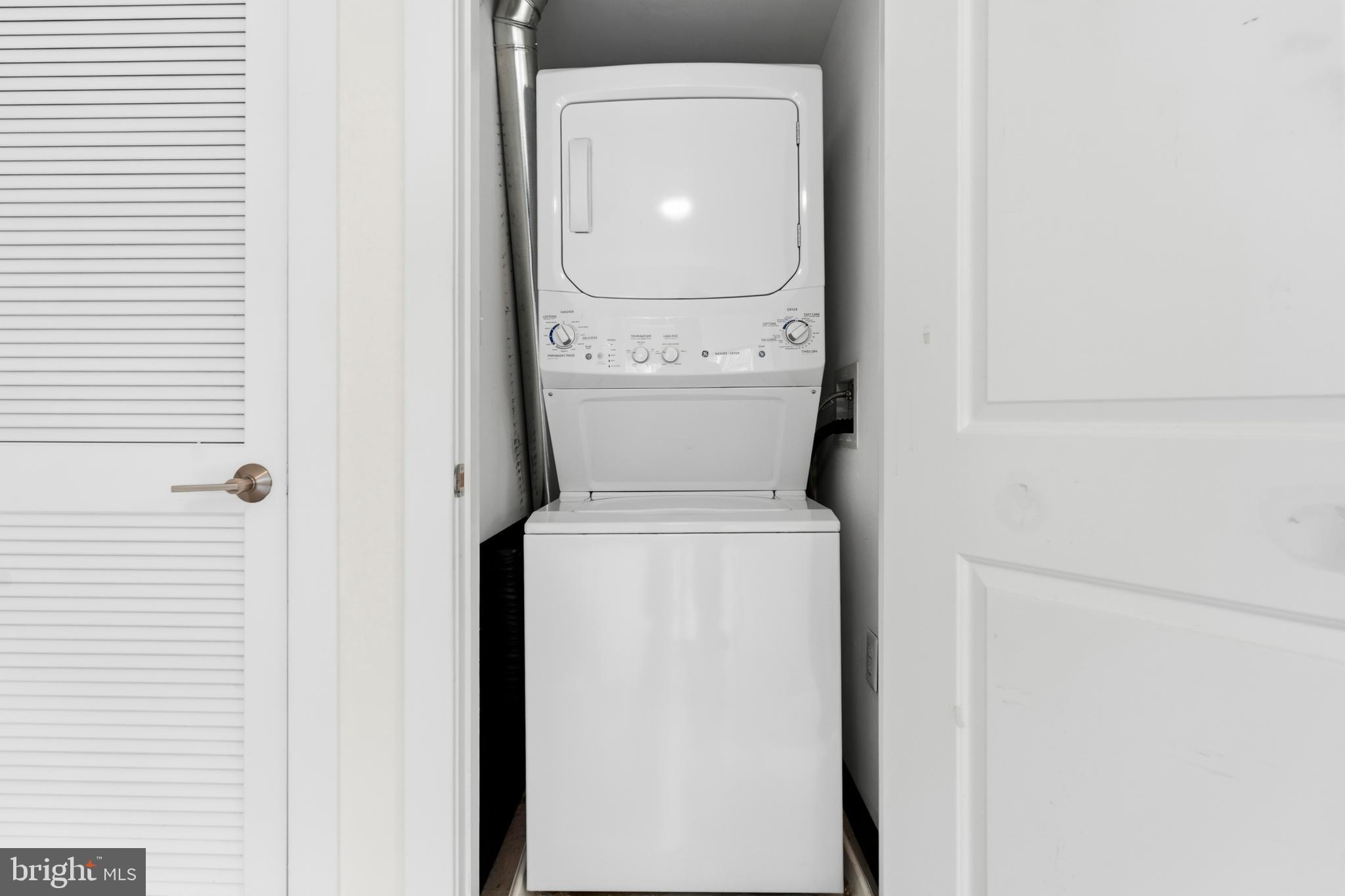 4226 7th Street Northwest, Unit 101 Washington, DC 20011 - Photo 10 of 23 a utility room with dryer and washer