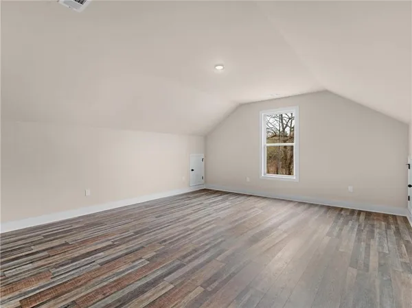 a view of an empty room and a window