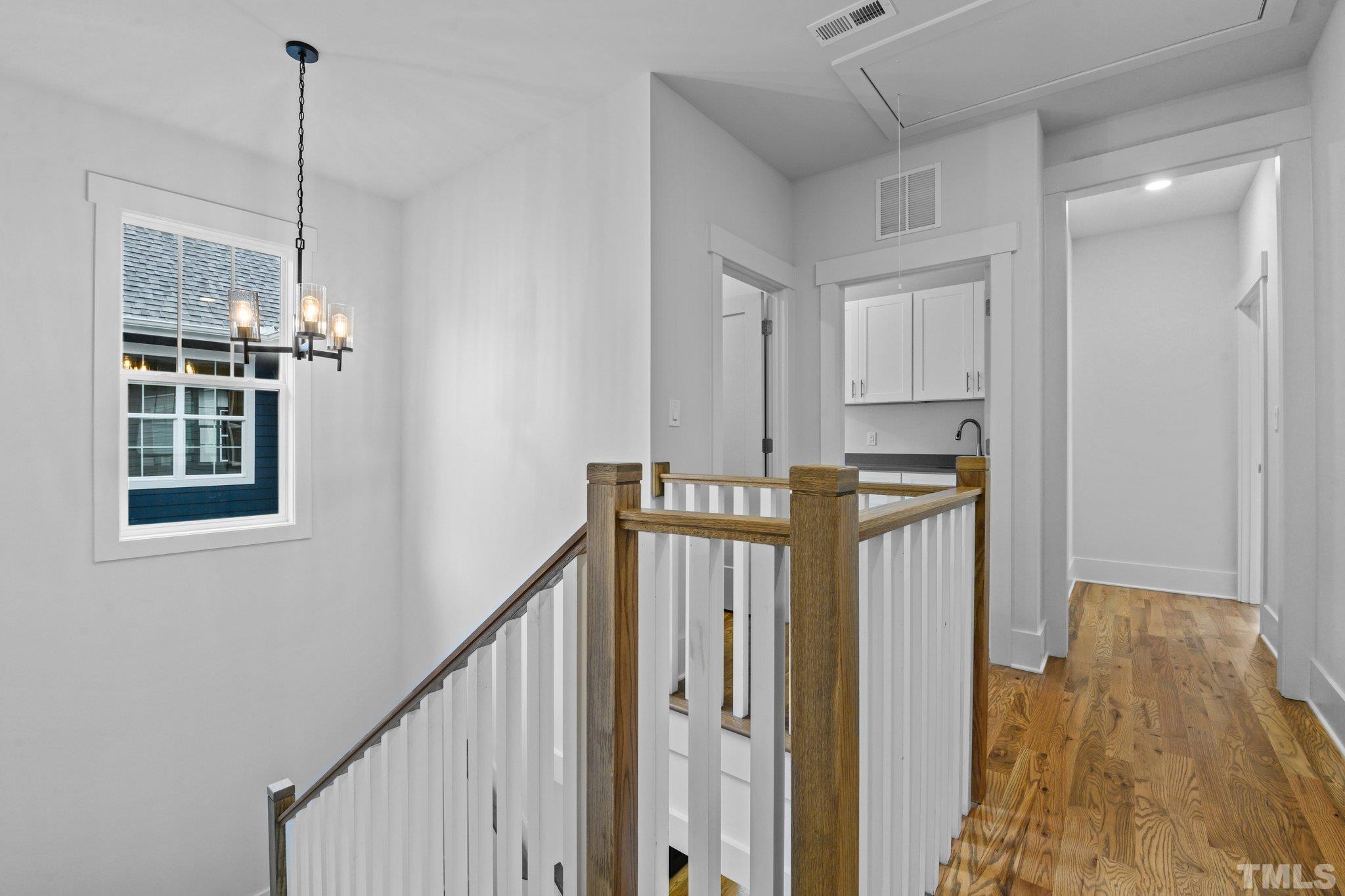 1019 Glascock Street Raleigh, NC 27610 - Photo 19 of 30 a view of a hallway with windows