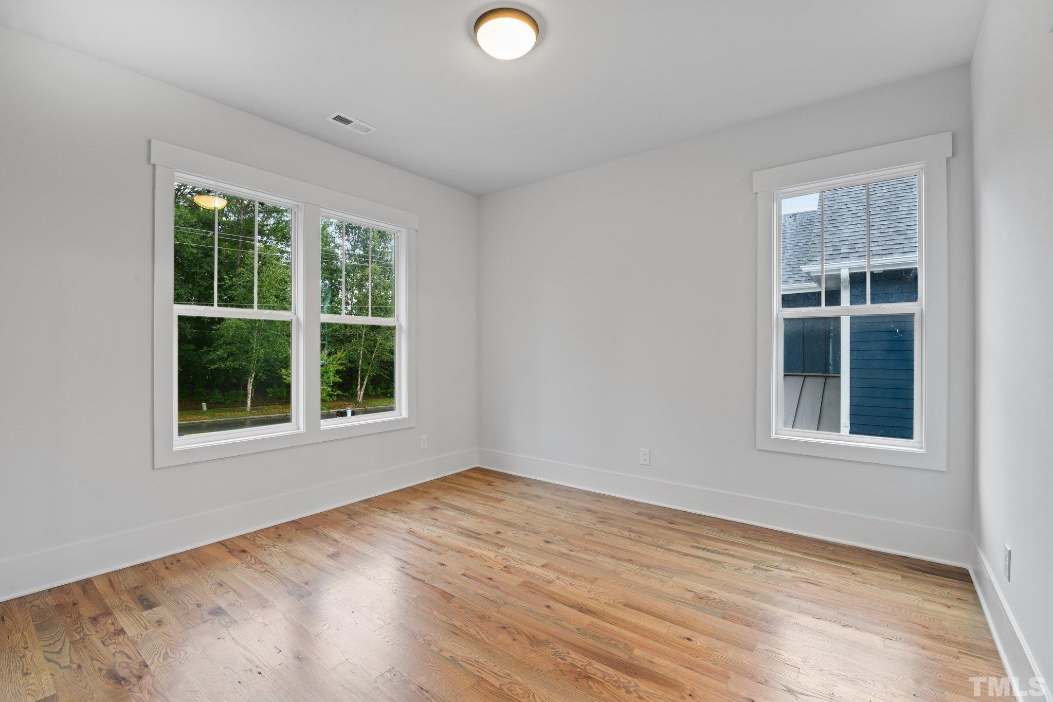 1019 Glascock Street Raleigh, NC 27610 - Photo 20 of 30 an empty room with a window