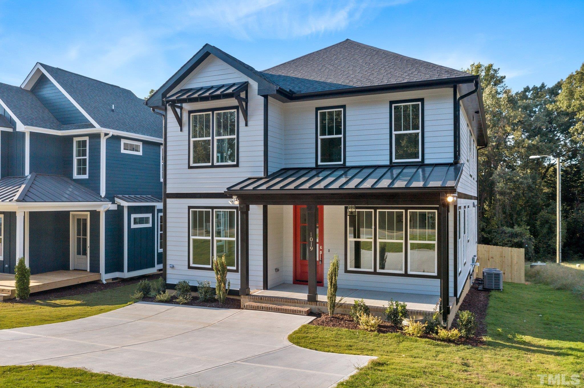 1019 Glascock Street Raleigh, NC 27610 - Photo 3 of 30 a front view of a house with a yard