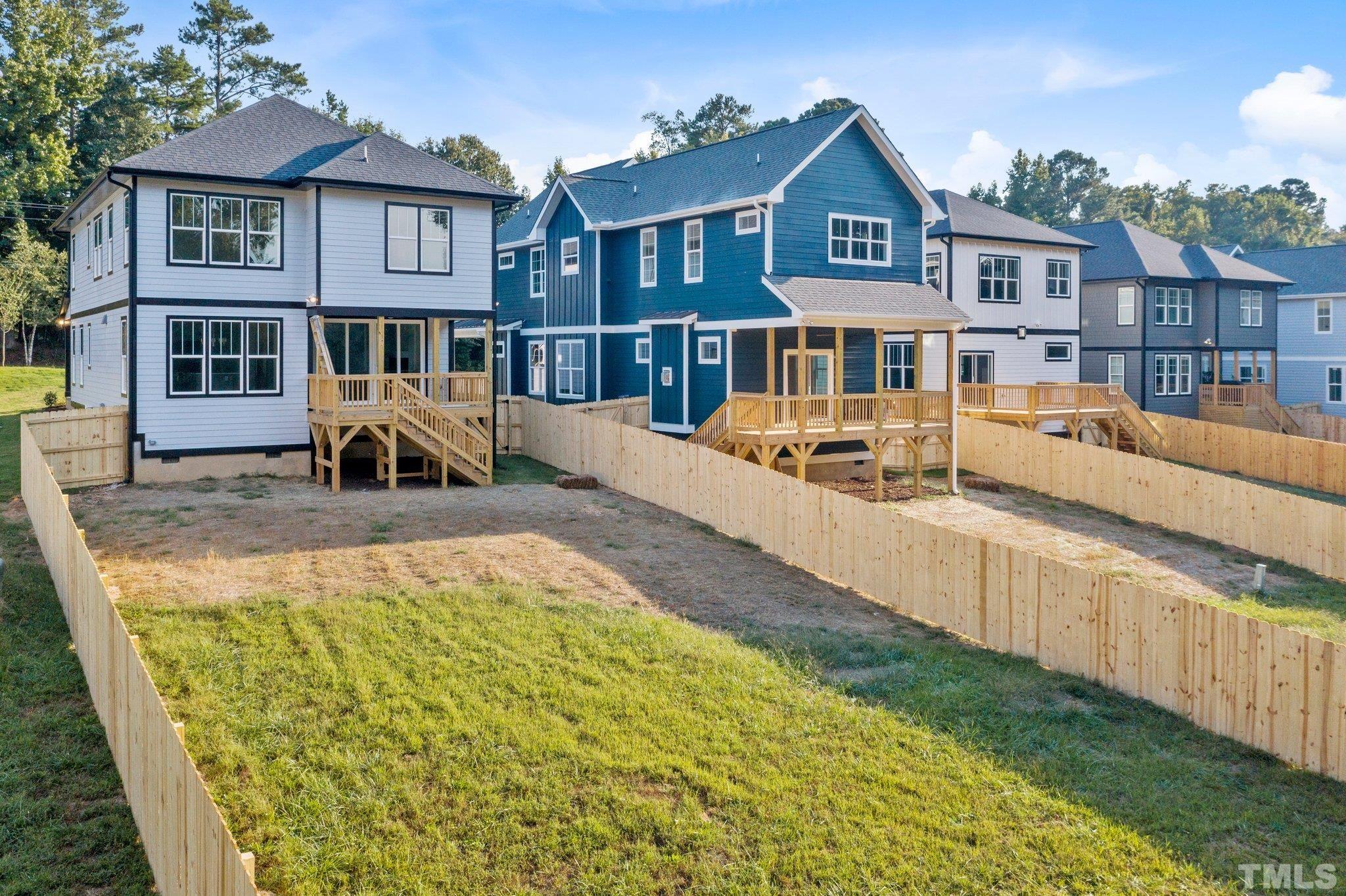 1019 Glascock Street Raleigh, NC 27610 - Photo 24 of 30 a front view of a house with a yard outdoor seating and barbeque oven