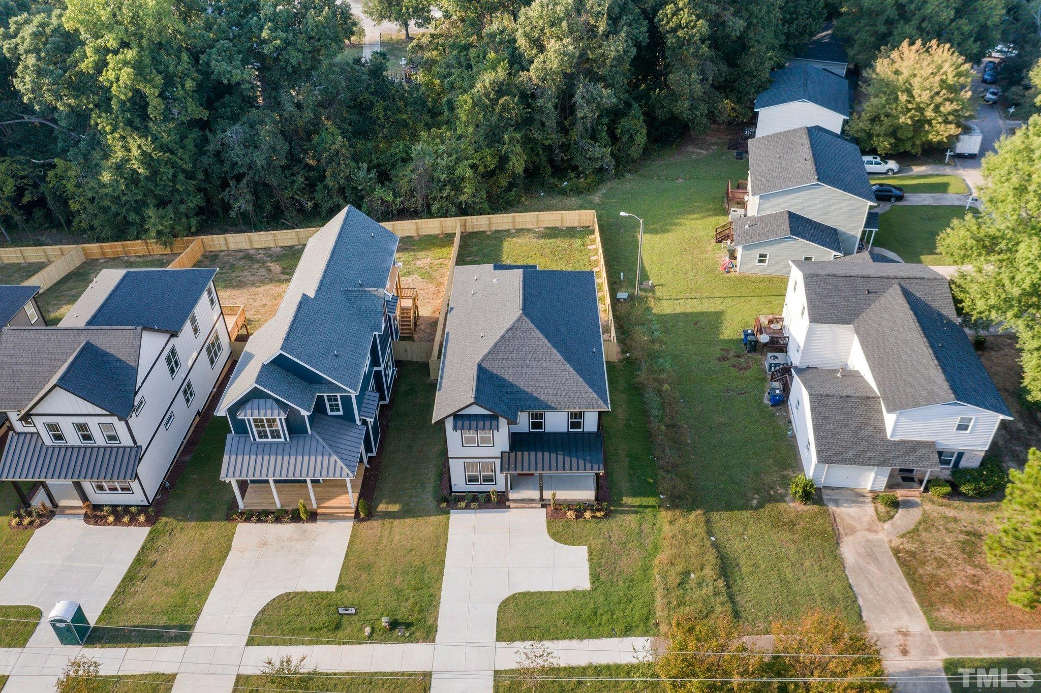 1019 Glascock Street Raleigh, NC 27610 - Photo 30 of 30 an aerial view of multiple houses with yard