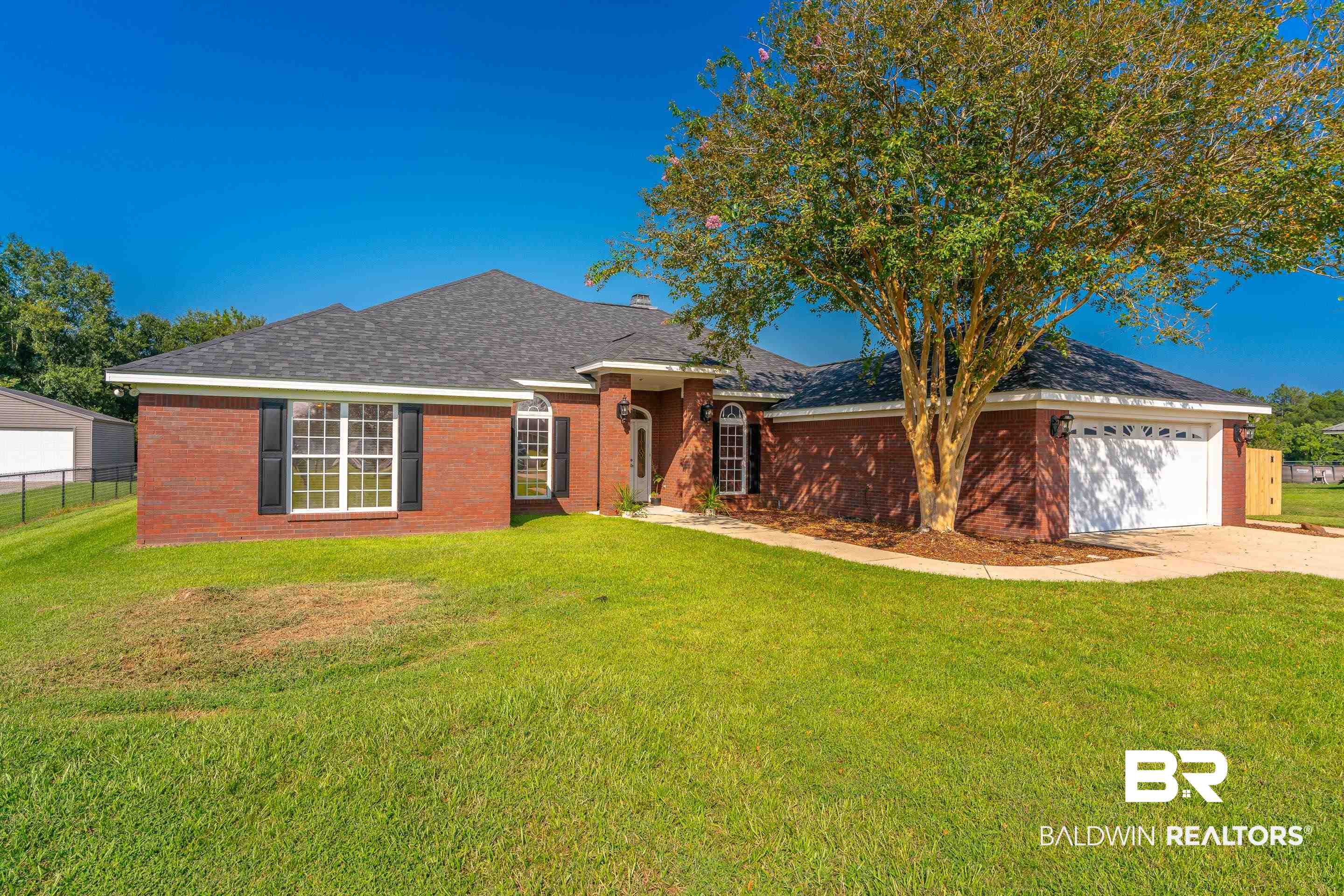 9477 Deerfield Drive Irvington, AL 36544 - Photo 57 of 58 Single story home featuring a front lawn and a garage