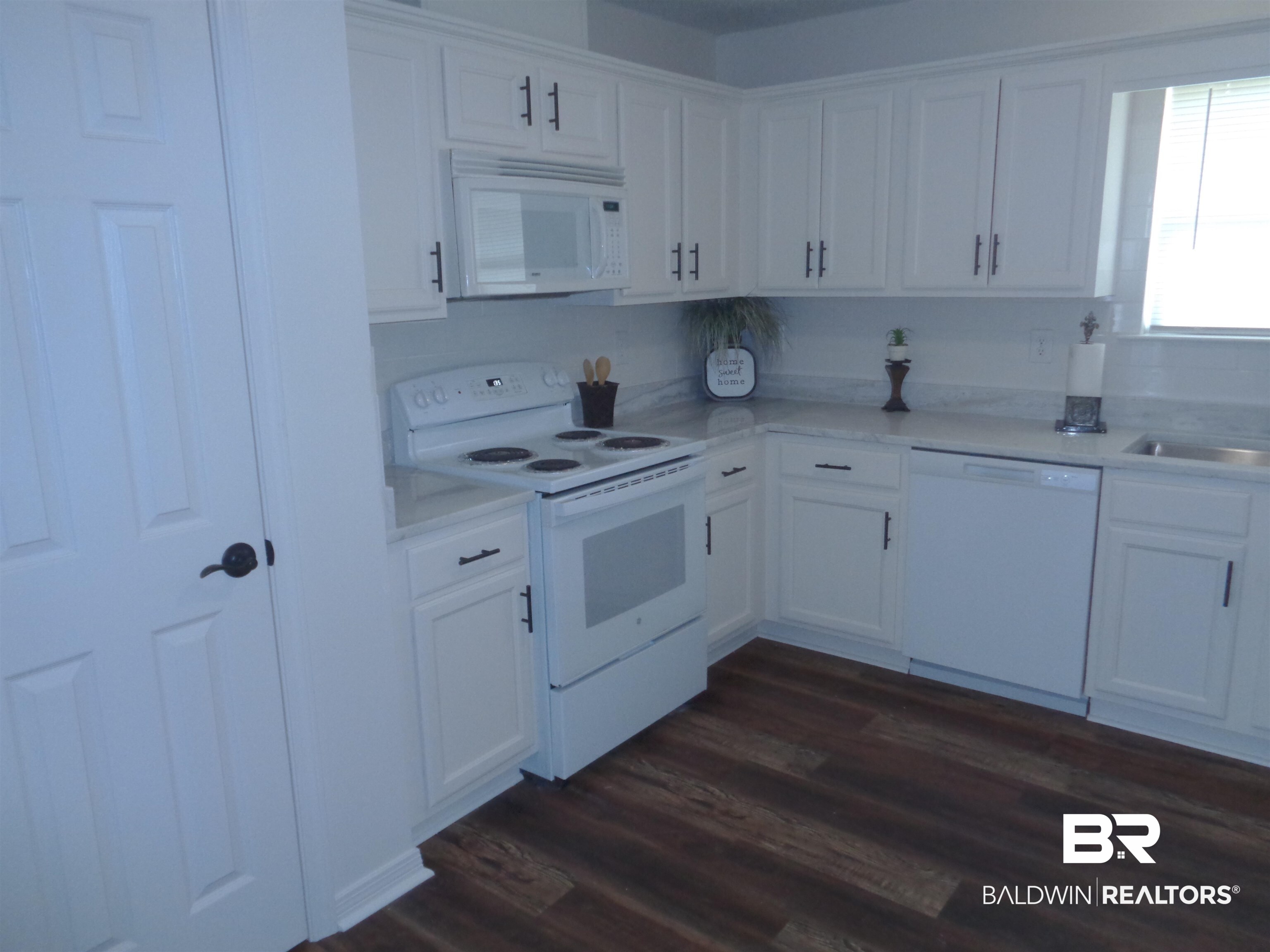 1557 Majesty Loop Foley, AL 36535 - Photo 6 of 25 12x11. Pantry closet. Electric stove w/microwave.