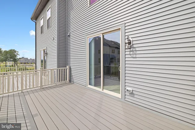 a view of a balcony with wooden floor