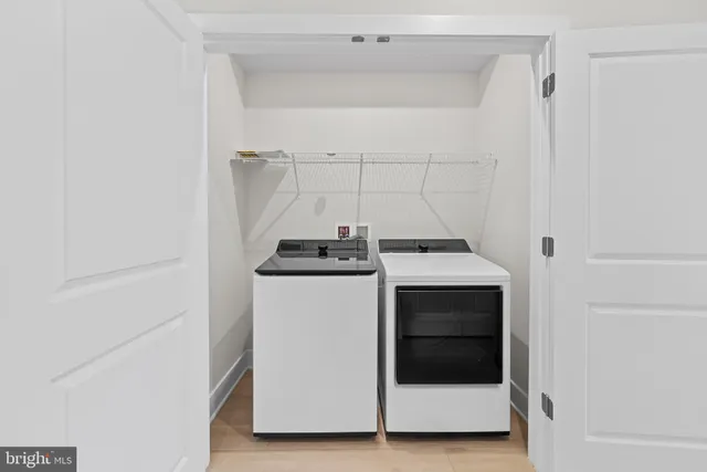 a view of a hallway with a wooden floor