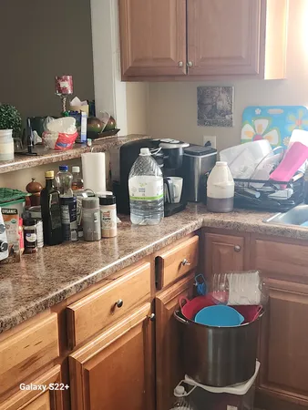 a kitchen with stainless steel appliances granite countertop a sink and cabinets