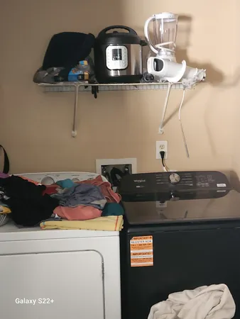 a room with stainless steel appliances and cabinets