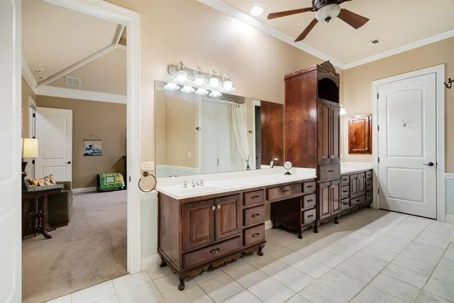 a large bathroom with a double vanity sink a large mirror and a shower