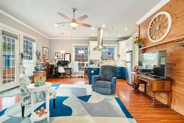 a living room with fireplace furniture and a flat screen tv