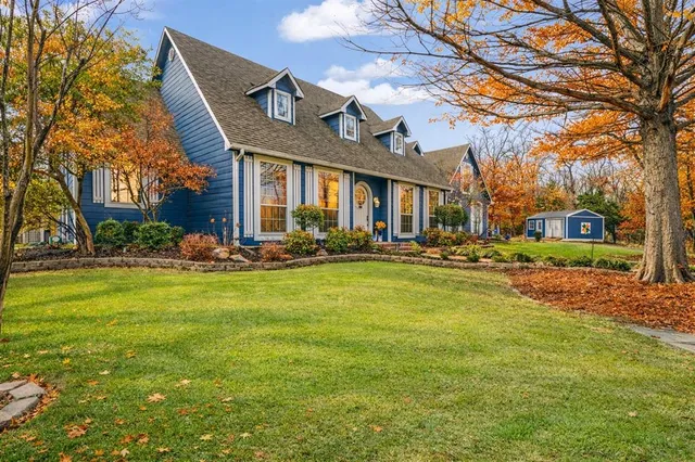 a front view of building with yard