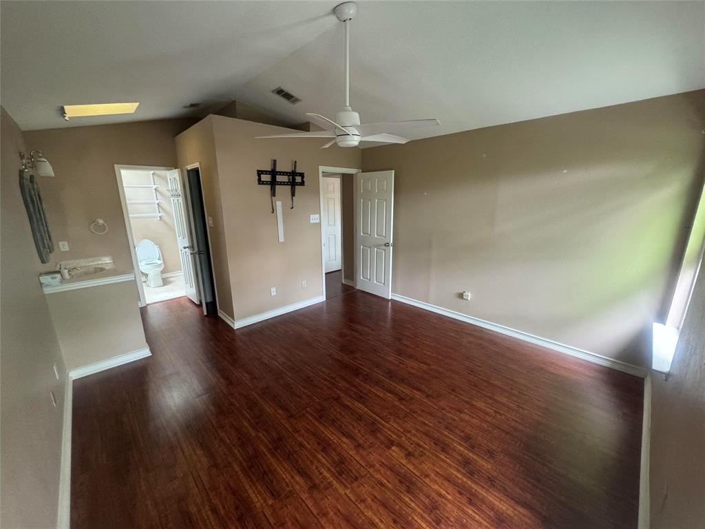 4649 Misty Ridge Drive Fort Worth, TX 76137 - Photo 4 of 25 a view of a livingroom with wooden floor and a refrigerator