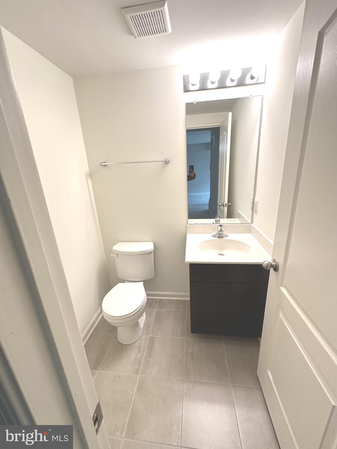 211 Arrowood Drive Smyrna, DE 19977 - Photo 12 of 22 a bathroom with a sink toilet and mirror